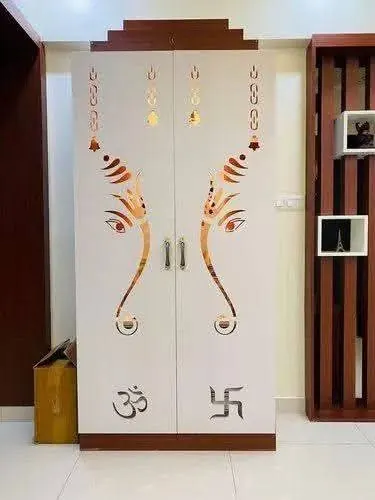 White pooja cabinet with Ganesha CNC-cut doors and Om and swastika symbols